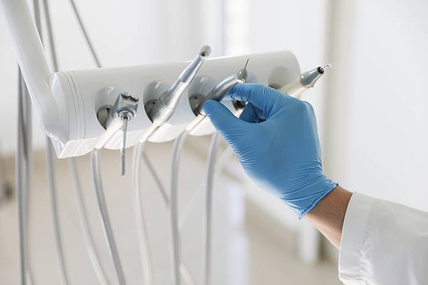 Professional Tooth Extraction technician working in Huntley, IL